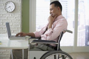 Antelope Valley Disability Attorneys Businessman Working on His Laptop in wheelchair